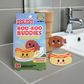 Boo Boo Buddies Drumstick and Hotdog bandages displayed by bathroom sink, fun food-themed waterproof bandaids for kids’ everyday comfort.
